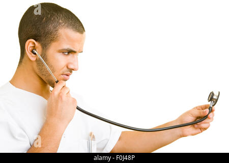 Young moroccan doctor using carefully a stethoscope Stock Photo