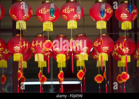 Red lanterns with gold lettering in a temple in Shanghai, China 2013