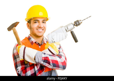 Construction worker holding drill machine and hammer Stock Photo