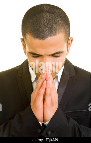 Religious business man folding his hands for a prayer Stock Photo