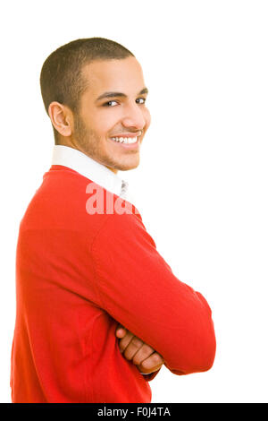 Side view of young happy man with arms crossed Stock Photo