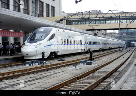 (150817) -- HARBIN, Aug. 17, 2015 (Xinhua) -- The high-speed train D7989 prepares to depart for Qiqihar at the Harbin Railway Station in Harbin, capital of northeast China's Heilongjiang Province, Aug. 17, 2015. China's northernmost high-speed railway between two cities of Harbin and Qiqihar in Heilongjiang started operation on Monday. With a designated speed of 250 kilometers per hour and eight stops, the trip from Harbin to Qiqihar was reduced from three hours to 85 minutes. The trains have been modified to adapt to temperatures as low as minus 40 degrees Celsius and resist adverse weather,  Stock Photo