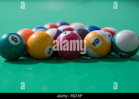 Close up of balls on a green pool-table Stock Photo