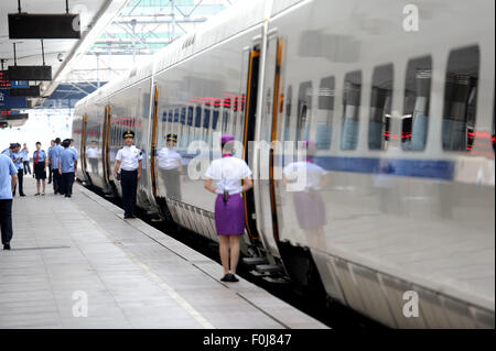 (150817) -- HARBIN, Aug. 17, 2015 (Xinhua) -- The high-speed train D7989 prepares to depart for Qiqihar at the Harbin Railway Station in Harbin, capital of northeast China's Heilongjiang Province, Aug. 17, 2015. China's northernmost high-speed railway between two cities of Harbin and Qiqihar in Heilongjiang started operation on Monday. With a designated speed of 250 kilometers per hour and eight stops, the trip from Harbin to Qiqihar was reduced from three hours to 85 minutes. The trains have been modified to adapt to temperatures as low as minus 40 degrees Celsius and resist adverse weather,  Stock Photo