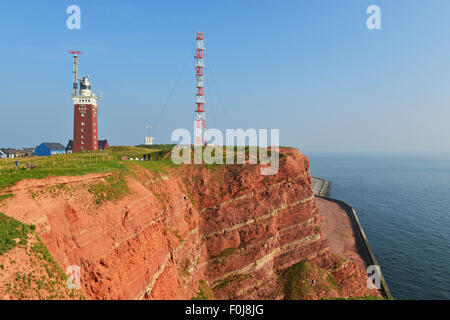 Red rock cliffs, transmission tower and lighthouse, Heligoland, Schleswig-Holstein, Germany Stock Photo