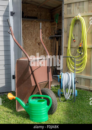 Wooden shed with different garden tools and equipment Stock Photo