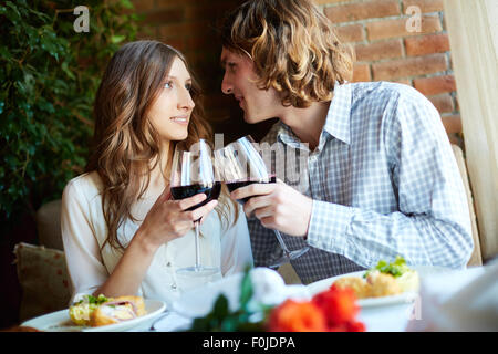 Young couple having romantic dinner in cafe Stock Photo