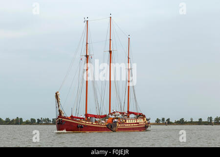 Old clipper sailing ship on the IJsselmeer, near the historic city of Enkhuizen, North Holland, The Netherlands. Stock Photo