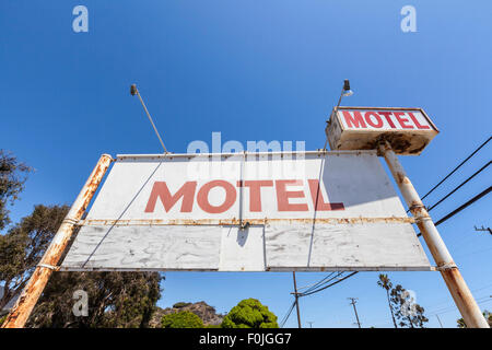 Old rusty abandoned motel sign. Stock Photo