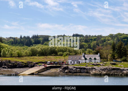 Looking across Ulva Sound to The Boathouse seafood restaurant by Ulva ferry jetty. Isle of Mull, Inner Hebrides, Western Isles, Scotland, UK Stock Photo