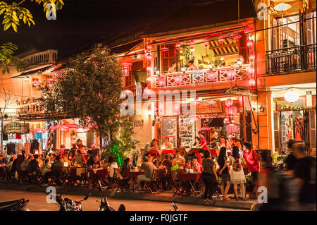 Hoi An, Vietnam Street scene with a tourist shop on the pavement with ...