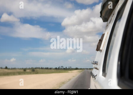 Rear view from the car driving in the north of Namibia Stock Photo