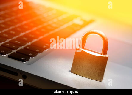 Lock on laptop keyboard with shallow depth of field Stock Photo