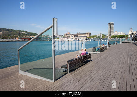 Rambla de Mar in city of Barcelona, wooden boardwalk promenade at Port Vell, Catalonia, Spain Stock Photo