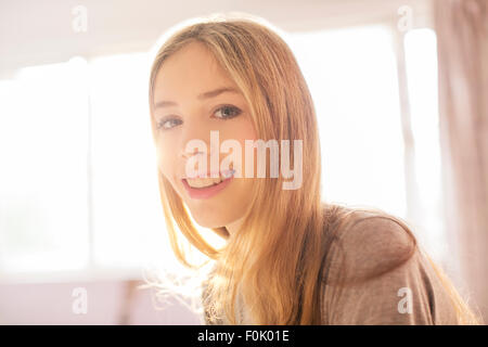 Portrait smiling blonde teenage girl