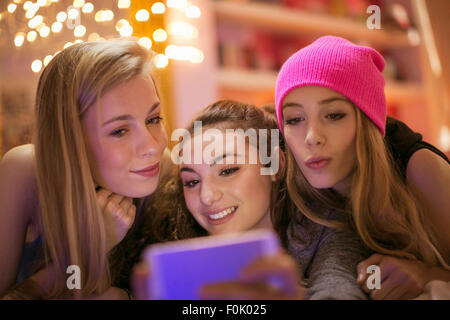 Teenage girls taking selfie with camera phone Stock Photo