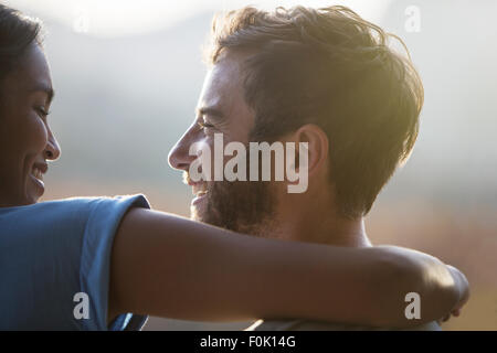 Close up smiling couple hugging Stock Photo