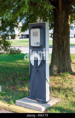 A Blink EV charging station sits idle waiting for the next electric vehicle to be charged. Stock Photo