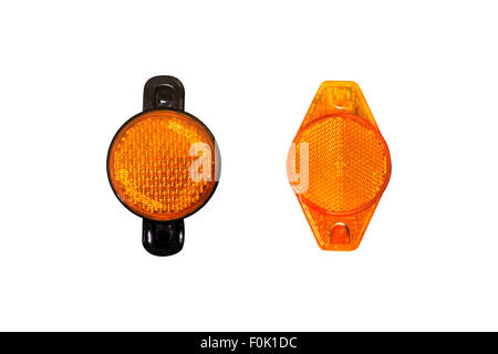 Close up detailed front view of orange headlights of a bicycle, isolated on white background. Stock Photo