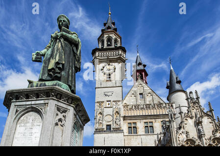 Statue of medieval printer Dirk Martens and belfry, Schepenhuis / Aldermen's House at town square in Aalst, Flanders, Belgium Stock Photo