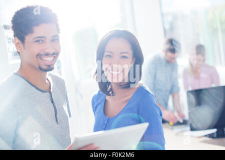 Portrait confident creative business people using digital tablet Stock Photo