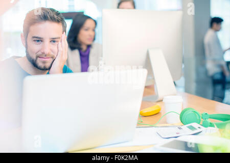 Creative business people working at laptop and computer in office Stock Photo