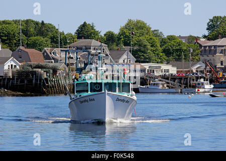 Lobster boats on moorings in harbor waterfront Vinalhaven Island Maine New England USA Stock Photo
