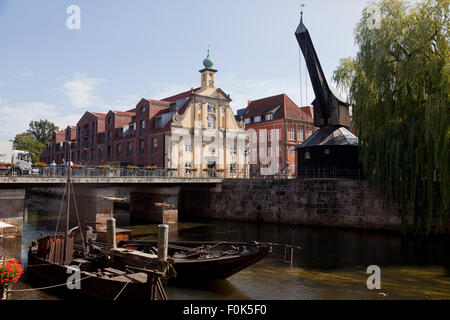 old harbour with treadwheel crane and Altes Kaufhaus, Hanseatic Town of Lüneburg, Lower Saxony, Germany Stock Photo