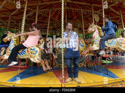 Traditional British merry go round fairground carousel ride Stock Photo