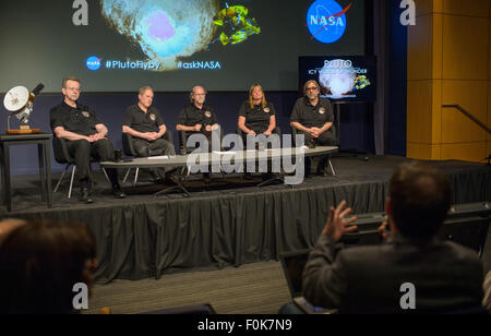 Jim Green, director of Planetary Science at NASA Headquarters in Washington, Alan Stern, New Horizons principal investigator at Southwest Research Institute (SwRI) in Boulder, Colorado, Michael Summers, New Horizons co-investigator at George Mason University in Fairfax, Virginia, Cathy Olkin, New Horizons deputy project scientist at SwRI, and William McKinnon, New Horizons co-investigator at Washington University in St. Louis, listen to a question from a member of the media during a New Horizons science update where new images and the latest science results from the spacecraft's historic July Stock Photo