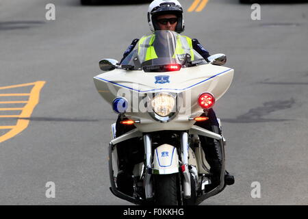 What you see in your rear view mirror when pursued by a policeman on a motorcycle Stock Photo
