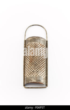 Antique grater for nutmeg isolated on white. Stock Photo