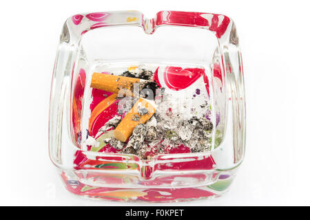 An ashtray with cigarette butts, isolated on white. Stock Photo