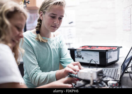 Two schoolgirls with laptop in robotics class Stock Photo