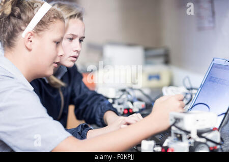 Two schoolgirls with laptop in robotics class Stock Photo