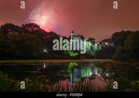 Fireworks explode over Belvedere Castle in Central Park in celebration of the New York Philharmonic's 50th anniversary. Stock Photo