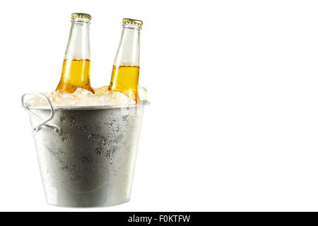 Two long neck bottles of beer in a bucket with ice isolated on white with copy space Stock Photo