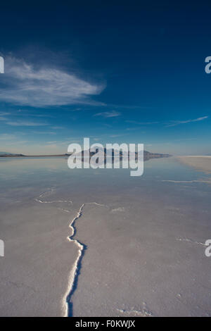 Bonneville Salt Flats International Speedway. Mystical reflection of desert mountains in sunset water Stock Photo