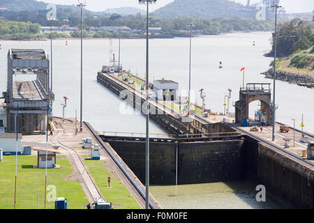 Gates and basin of Miraflores Locks Panama Canal filling to raise a ship. Panama City, Panama 2014. Stock Photo