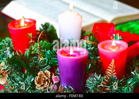 Advent wreath, or Advent crown, is a Christian tradition that symbolizes the passage of the four weeks of Advent in the liturgic Stock Photo