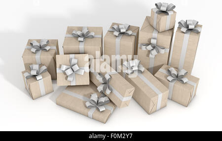 A scattered collection of gift boxes wrapped in brown paper and a white ribbon and bow on an isolated white studio background Stock Photo