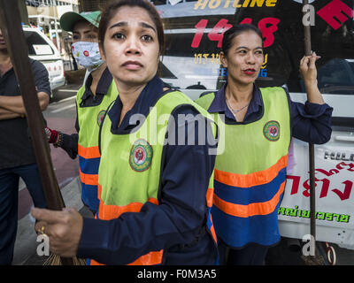 Bangkok, Thailand. 18th Aug, 2015. Women who work as street sweepers for the city of Bangkok look at Erawan Shrine before cleaning the area. An explosion at Erawan Shrine, a popular tourist attraction and important religious shrine in the heart of the Bangkok shopping district, killed at least 20 people and injured more than 120 others, including foreign tourists, during the Monday evening rush hour. Twelve of the dead were killed at the scene. Thai police said an Improvised Explosive Device (IED) was detonated at 18.55. Credit:  ZUMA Press, Inc./Alamy Live News Stock Photo