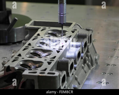 Automated coordinate measuring machine with touch probe head in action. Stock Photo