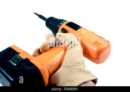 hand with a leather work glove holding a cordless drill Stock Photo