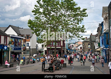 Buskers playing in the Town Centre in summer Keswick Cumbria England UK United Kingdom GB Great Britain Stock Photo