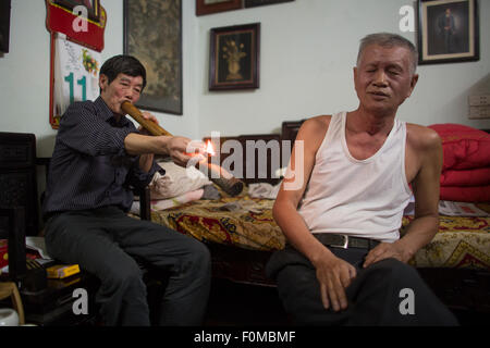 smoking opium in Vietnam Stock Photo