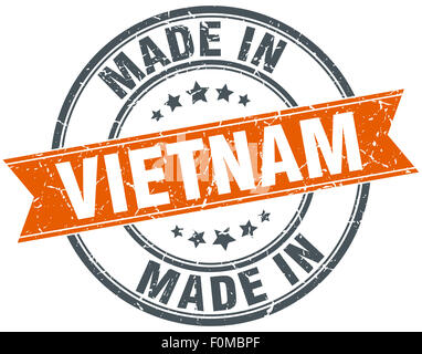 Vietnam orange grunge ribbon stamp on white Stock Photo