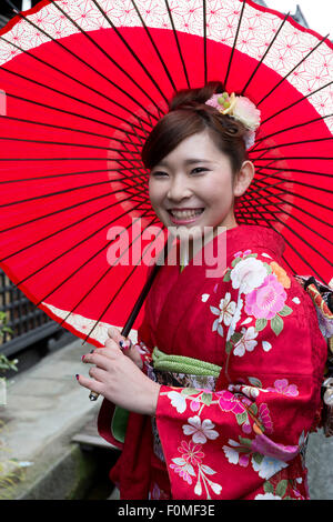 Young Japanese girl in traditional kimono and umbrella, Takayama, Central Honshu, Japan, Asia Stock Photo