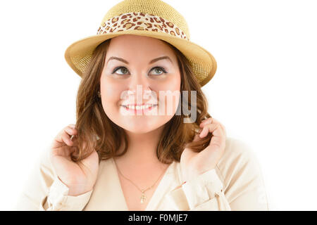 Smiling fat woman wearing a hat. Conceptual shoot. Stock Photo