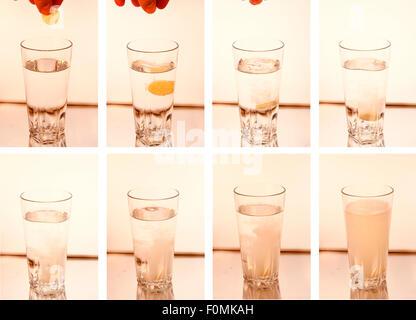 Bild-Combo: Tablette, die sich in einem Glas Wasser aufloest - Symbolbild Nahrungsmittel . Stock Photo